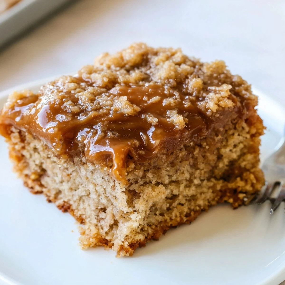 Delightful slice of caramel banana root beer sheet cake with rich frosting.  