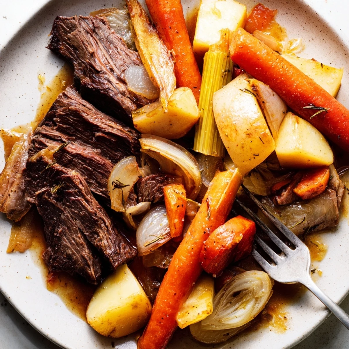 Succulent Sunday Pot Roast simmered with vibrant roasted veggies on a rustic table.  