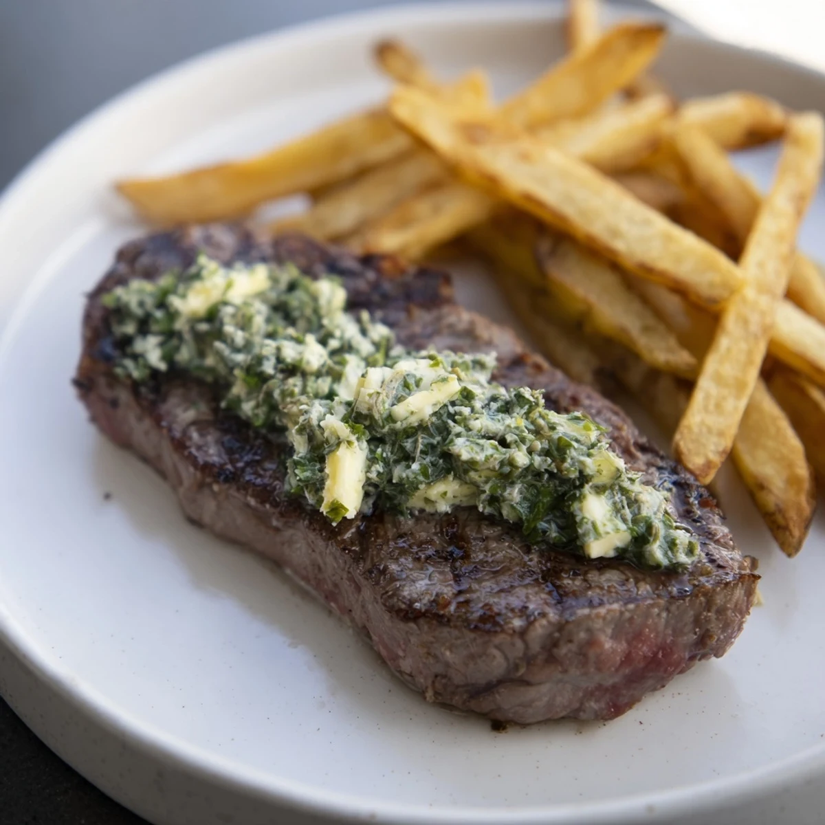 Juicy Steakhouse Garlic Butter Steak & Fries, seared to perfection and topped with melting garlic butter.