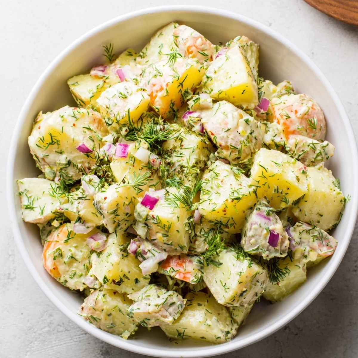 Enjoy the flavors of creamy chopped egg and potato salad, perfect for a summer side dish.