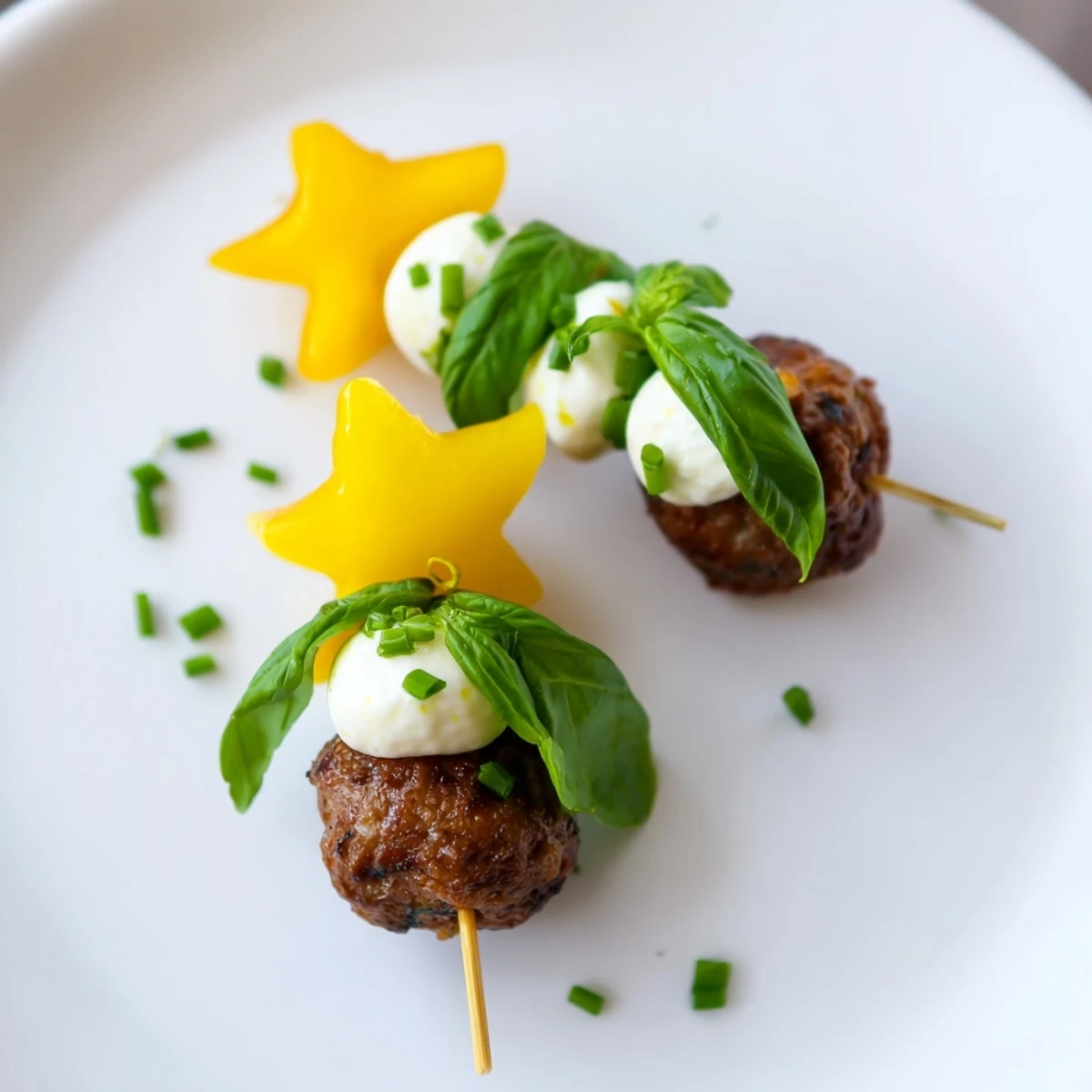 Festive Mini Meatball Christmas Trees, featuring juicy meatballs topped with yellow pepper stars for a delightful bite.