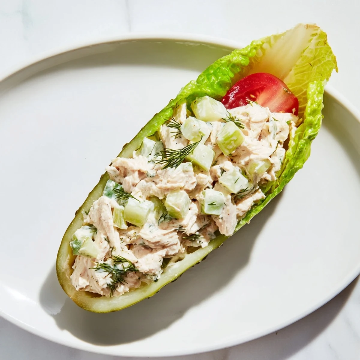 A close-up of a delightful pickle sandwich with chicken salad, perfect for a light lunch.