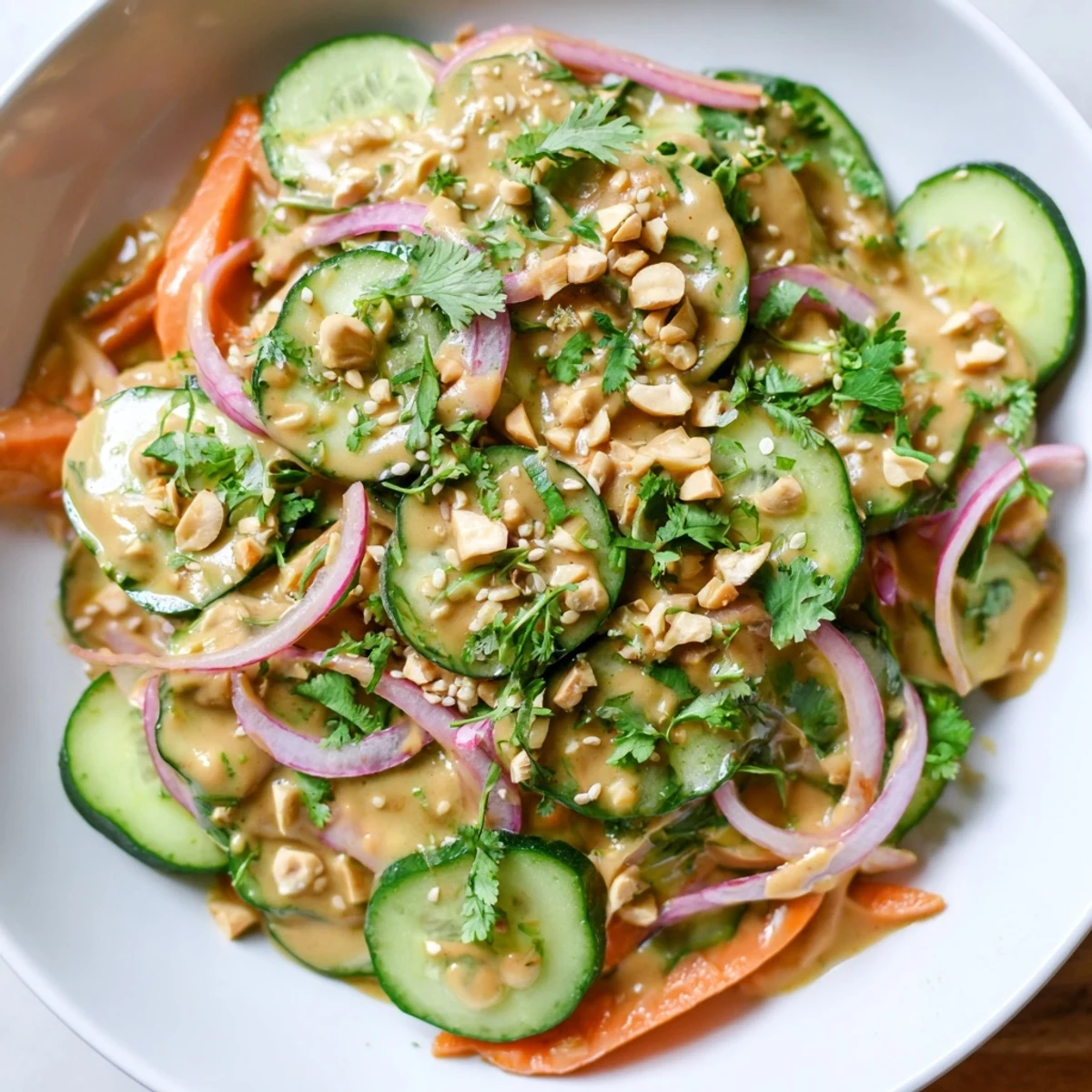 Fresh Thai-Style Peanut Cucumber Salad, vibrant with cilantro and peanuts, ready to enjoy.