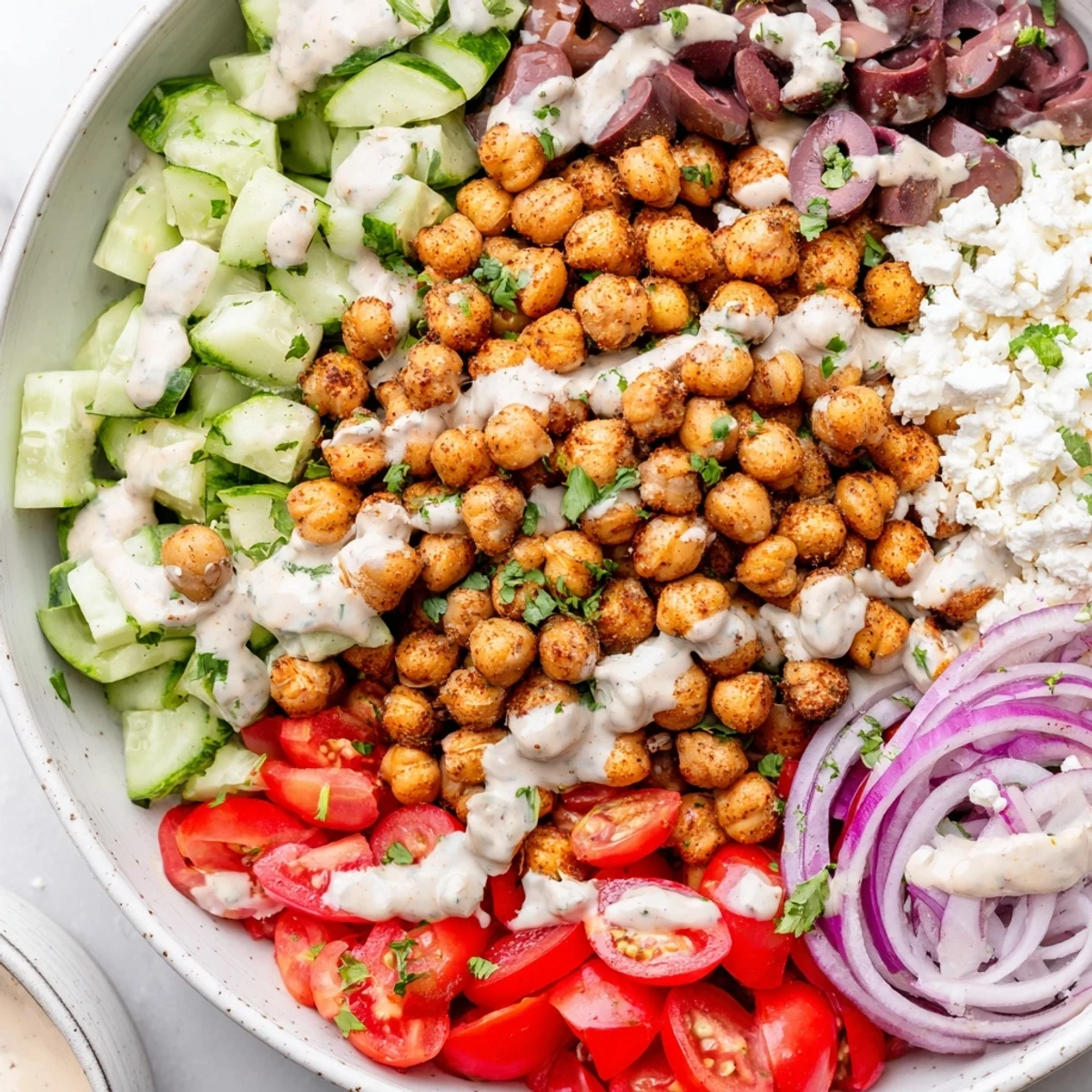 Enjoy a healthy Mediterranean Chickpea Bowl: crispy roasted chickpeas with fresh vegetables and grains.
