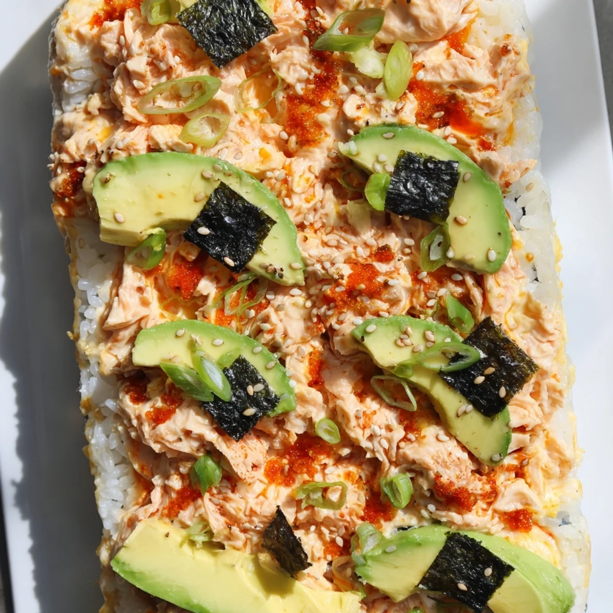 A savory Sushi Bake Casserole, with flaked salmon and creamy textures, perfect for a Japanese-inspired dinner.