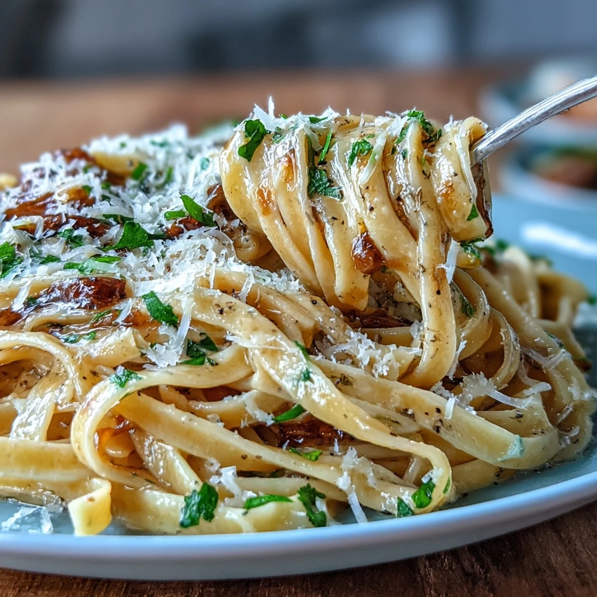 Delicate fresh egg pasta ribbons infused with truffle oil, served with a rich butter sauce and Parmesan.