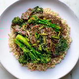 A beautiful photo of savory Slow-Cooker Beef & Broccoli, ready to be served over rice, a complete meal.