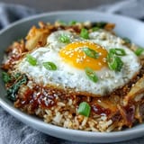 Fragrant fried rice packed with napa cabbage, kimchi, and gochujang, topped with a perfectly runny fried egg.  
