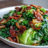 Sizzling fried cabbage, bacon, and onions – a savory Southern side dish.