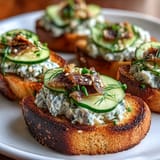 Savory sardine mixture on crunchy fried rice cakes, ready to enjoy.