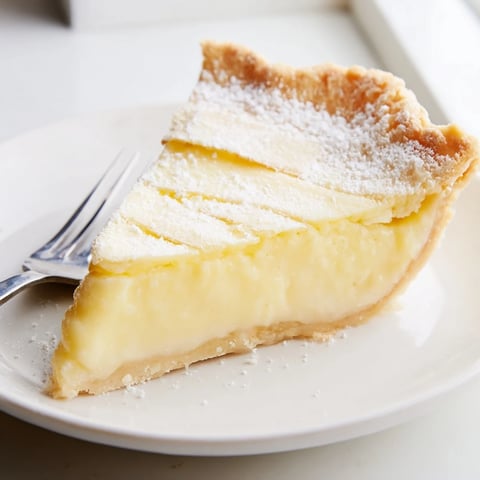 Delicious Water Pie cooling on a counter, showcasing its creamy filling and flaky crust.  