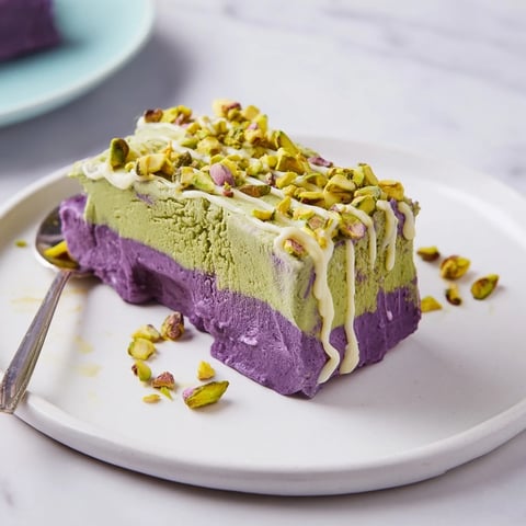 Creamy ube and pistachio ice cream bars with vibrant colors and flavors.  