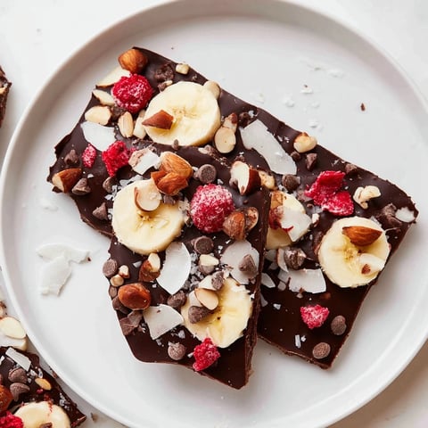Frozen Chocolate Banana Bark with a decadent chocolate layer and crunchy toppings.