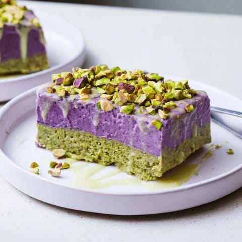 Delicious frozen ube and pistachio bars, perfect summer treat garnished with nuts.  