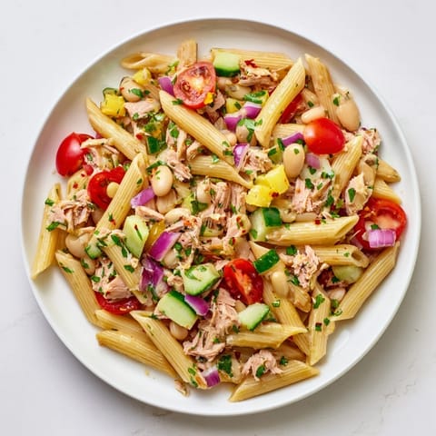 Earthy white beans and spicy tuna mingle beautifully in this delicious Spicy Tuna and White Bean Pasta Salad.