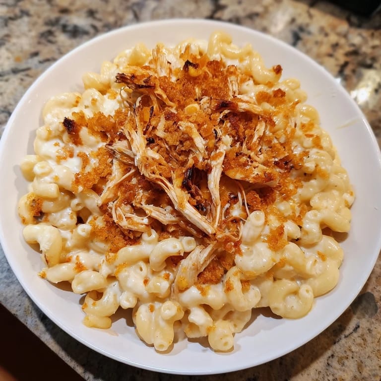 Creamy homemade Classic Mac & Cheese with BBQ Chicken, boasting tender chicken and cheesy perfection.