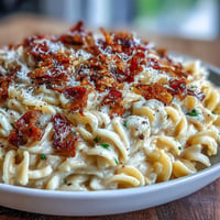 Close-up of creamy Caramelized Cabbage Carbonara with golden, tender cabbage strands.